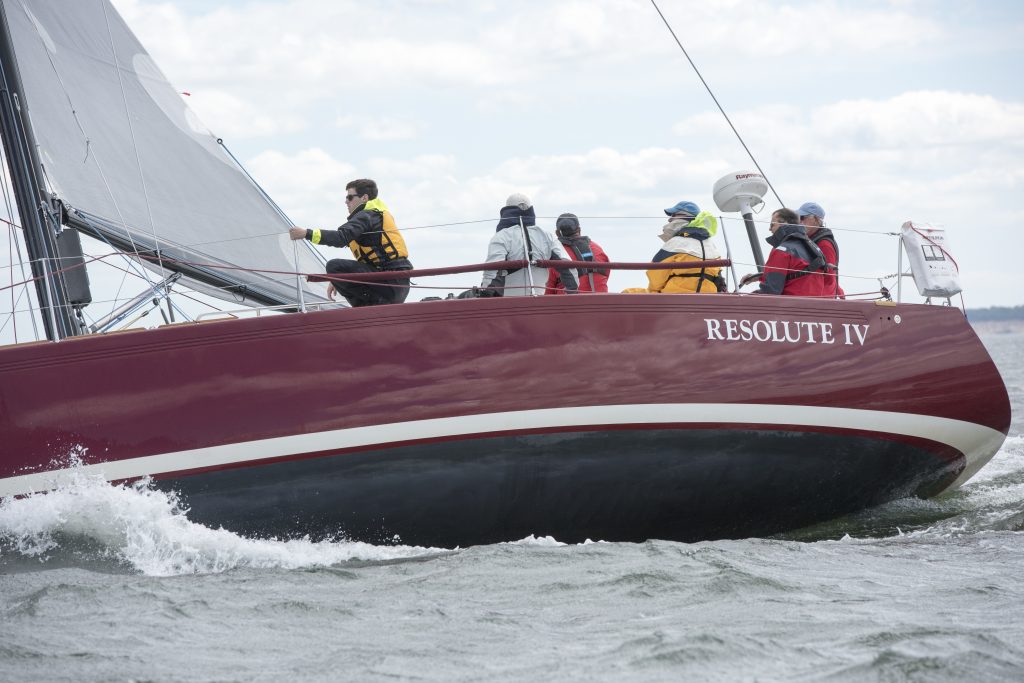 Tyler (in the yellow PFD and black jacket) enjoyed his first overnight race aboard Terrence Arndt’s IMX-40 Resolute IV (St. Louis, MO). © Allen Clark/PhotoBoat.com